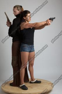 2021 01 OXANA AND XENIA STANDING POSE WITH GUNS 4…